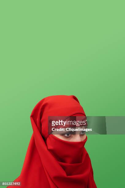 beautiful woman in niqab - cliqueimages stock-fotos und bilder