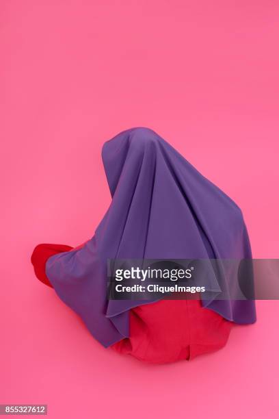 mysterious woman in headscarf - cliqueimages stock-fotos und bilder