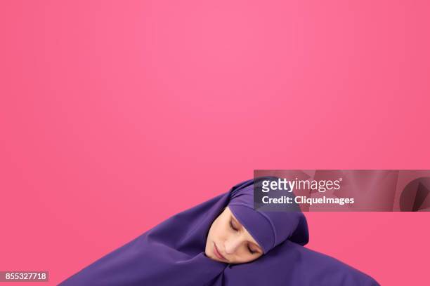 sleeping beauty in hijab - cliqueimages stock-fotos und bilder