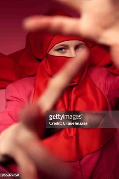 mysterious dance of woman in niqab - cliqueimages stock-fotos und bilder