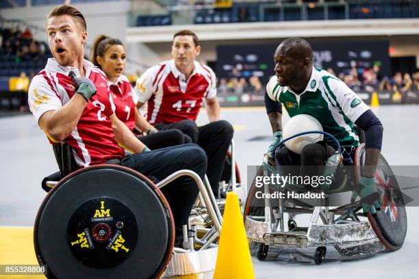 In this handout image provided by Jaguar Land Rover, Derek Hough takes part in the Jaguar Land Rover celebrity wheelchair rugby exhibition match...