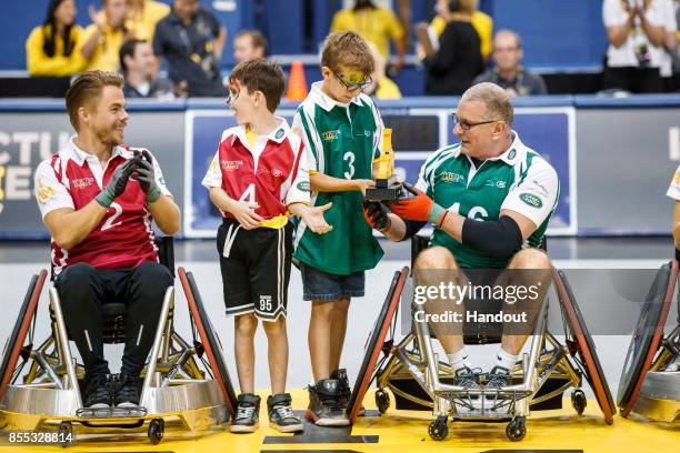 In this handout image provided by Jaguar Land Rover, Derek Hough and Robert Irvine take part in the Jaguar Land Rover celebrity wheelchair rugby...