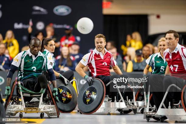 In this handout image provided by Jaguar Land Rover, Derek Hough takes part in the Jaguar Land Rover celebrity wheelchair rugby exhibition match...