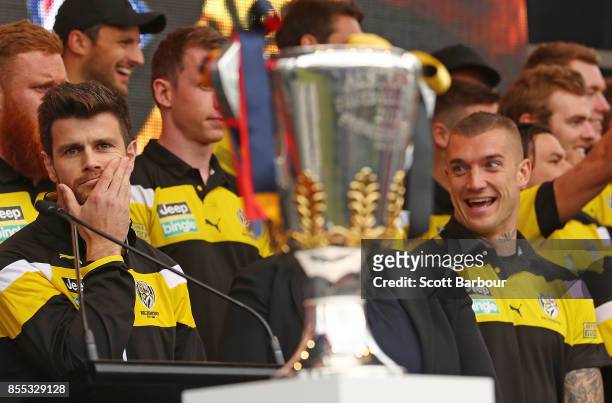 Trent Cotchin of the Tigers and Dustin Martin of the Tigers look towards the Premiership Cup as it sits on stage during the 2017 AFL Grand Final...