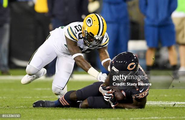 Deonte Thompson of the Chicago Bears makes a catch in front of Josh Hawkins of the Green Bay Packers in the third quarter at Lambeau Field on...