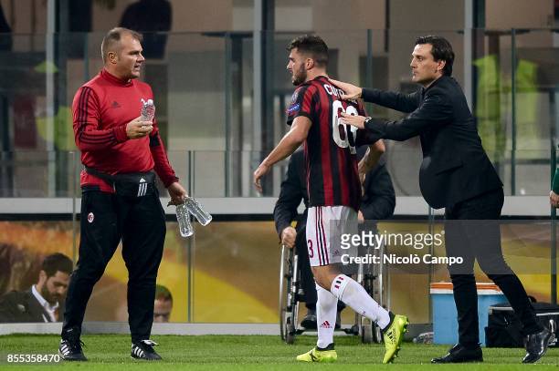 Patrick Cutrone of AC Milan celebrates with his coach Vincenzo Montella after scoring a goal during the UEFA Europa League Group D match between AC...