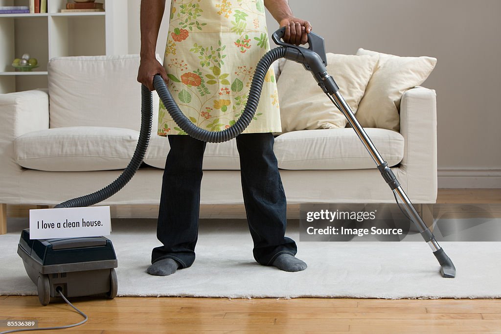A man vacuum cleaning