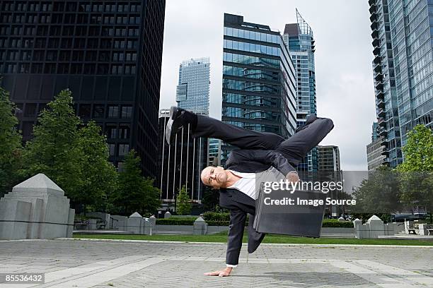 businessman practising capoeira - kicking bag stock pictures, royalty-free photos & images