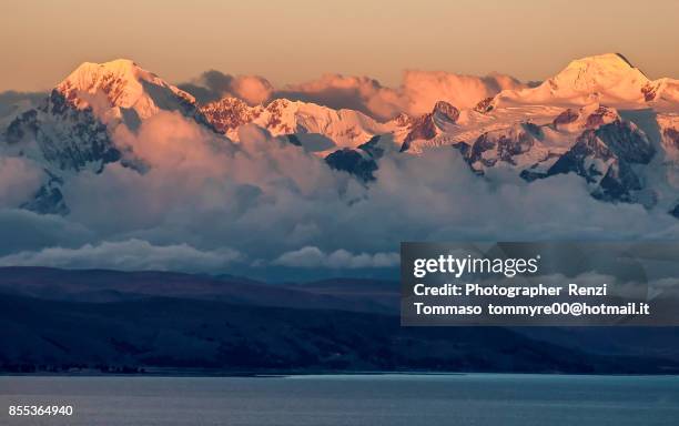 panoramic view with illampu and ancohuma mountain from isla del sol , titicaca lake - cordigliera delle ande foto e immagini stock