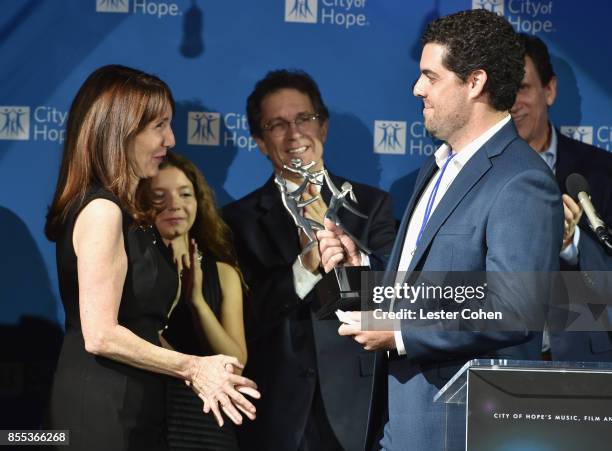 Jody Marsh, Zoey Marsh, President of Disney Channels Worldwide Gary Marsh, Honoree Saul Priceman PhD, accepting the "Songs of Hope Beverly and Ben...