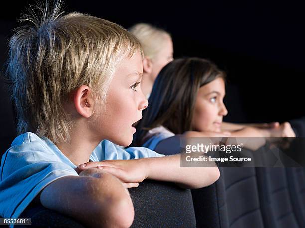 children watching a movie - epic film stock-fotos und bilder