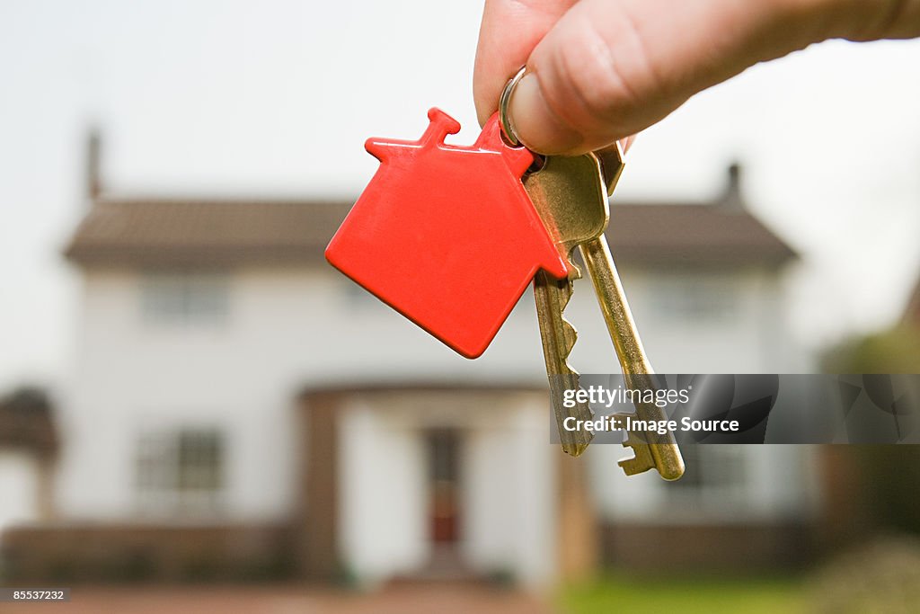 Person holding house keys