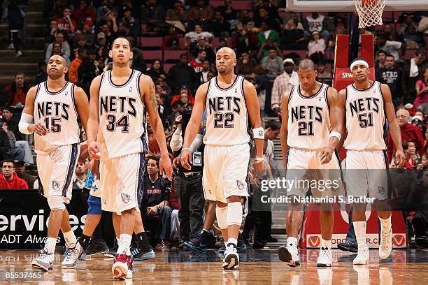 Vince Carter, Devin Harris, Jarvis Hayes, Bobby Simmons and Sean Williams of the New Jersey Nets walk on the court during the game against the New...