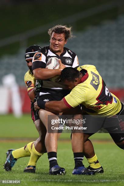 Pouri Rakete-Stones of Hawkes Bay is tackled during the round seven Mitre 10 Cup match between North Harbour and Hawke's Bay at QBE Stadium on...