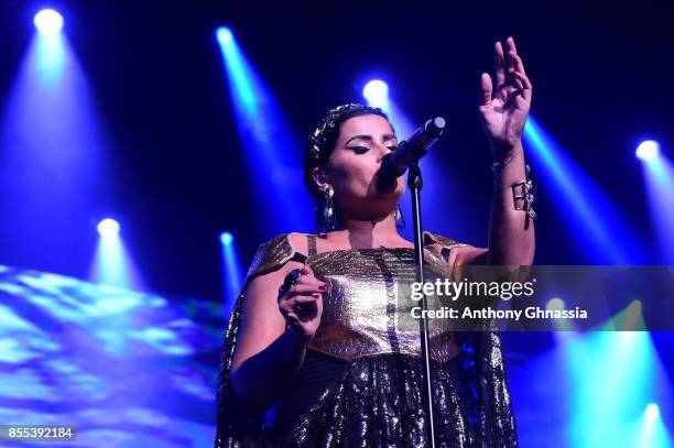 Nelly Furtado performs on stage at the auction for the inaugural "Monte-Carlo Gala for the Global Ccean" honoring Leonardo DiCaprio at the Monaco...