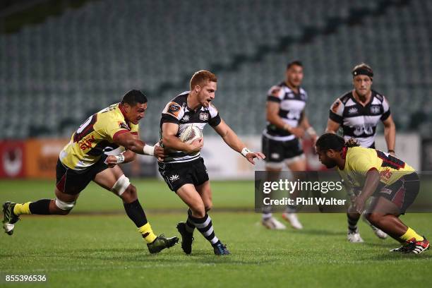 Ihaia West of Hawkes Bay is tackled during the round seven Mitre 10 Cup match between North Harbour and Hawke's Bay at QBE Stadium on September 29,...