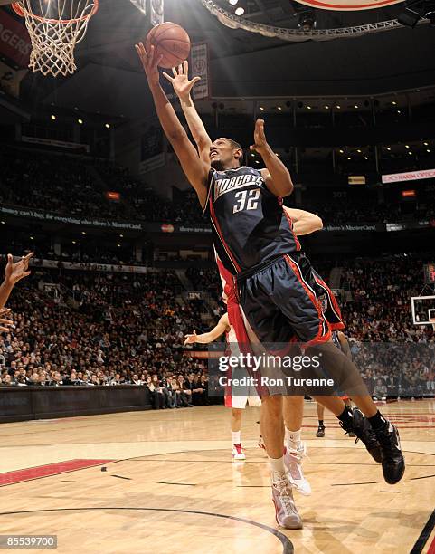 Boris Diaw of the Charlotte Bobcats puts up the layup in front of Andrea Bargnani of the Toronto Raptors during a game on March 20, 2009 at the Air...