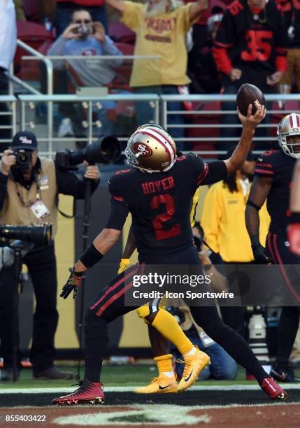 San Francisco 49ers Quarterback Brian Hoyer spikes the ball in the endzone after running for a touchdown during an NFL game between the Los Angeles...
