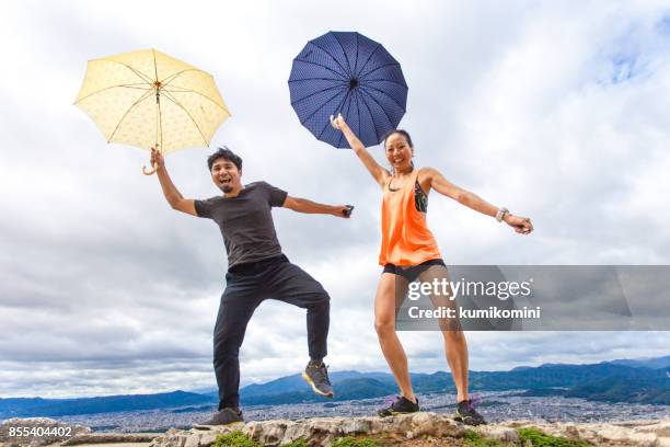 flying in the rain - couple dancing in the rain stock pictures, royalty-free photos & images