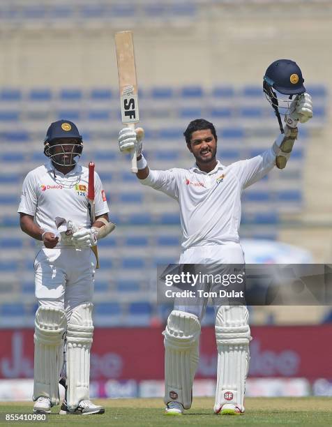 Dinesh Chandimal of Sri Lanka celebrates reaching his century during Day Two of the First Test between Pakistan and Sri Lanka at Sheikh Zayed Stadium...