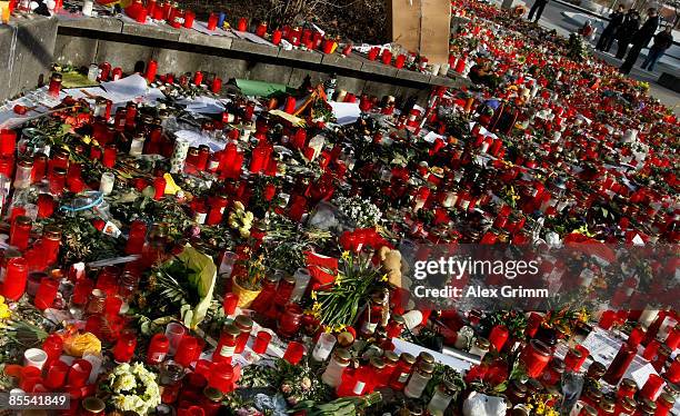 Flowers and candles are seen outside Albertville high school on March 21, 2009 in Winnenden near Stuttgart, Germany. 17 year old Tim Kretschmer...