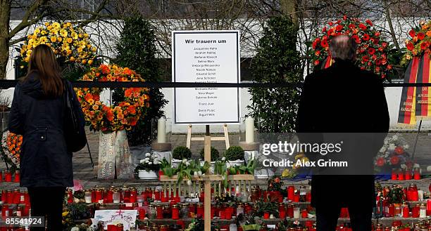 Mourners stand in front of a sign with the names of the victims outside Albertville high school on March 21, 2009 in Winnenden near Stuttgart,...