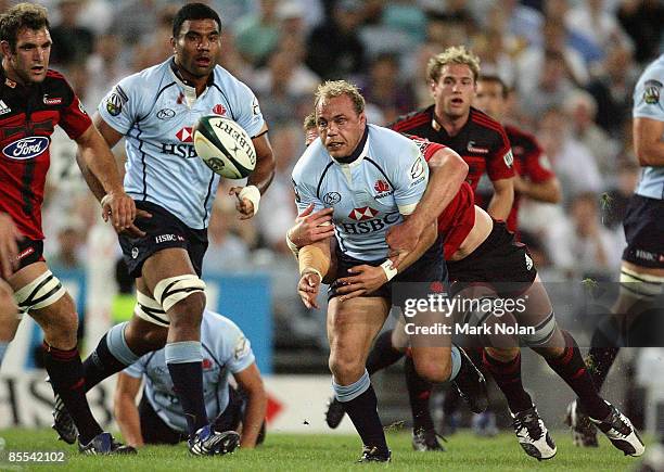 Phil Waugh of the Waratahs passes during the round six Super 14 match between the Waratahs and the Crusaders at ANZ Stadium on March 21, 2009 in...