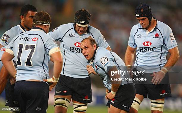 Phil Waugh of the Waratahs talks to his forwards during the round six Super 14 match between the Waratahs and the Crusaders at ANZ Stadium on March...