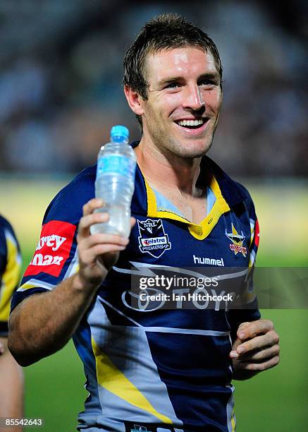 Ashley Graham of the Cowboys smiles to the crowd after winnning the round two NRL match between the North Queensland Cowboys and the Wests Tigers at...