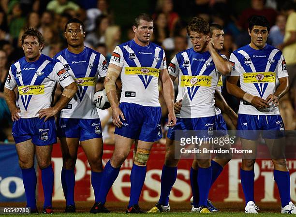 Bulldogs players look dejected after conceding a try to the Panthers during the round two NRL match between the Penrith Panthers and the Bulldogs at...