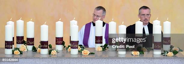 Candles are seen during a memorial service at the Sankt Karl Barromaeus church on March 21, 2009 in Winnenden near Stuttgart, Germany. President...