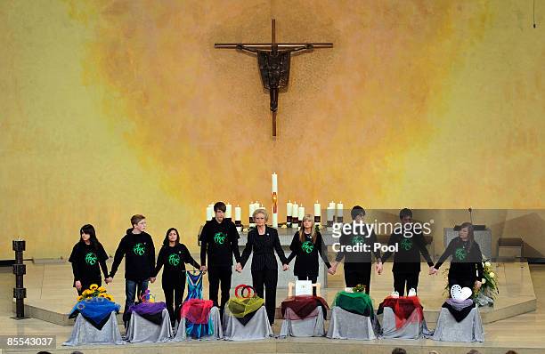Astrid Hahn , Albertville high school headteacher and her students attend a memorial service at the Sankt Karl Barromaeus church on March 21, 2009 in...