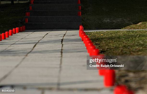 Candles stand along a path downtown Winnenden after a memorial service on March 21, 2009 in Winnenden near Stuttgart, Germany. President Horst...