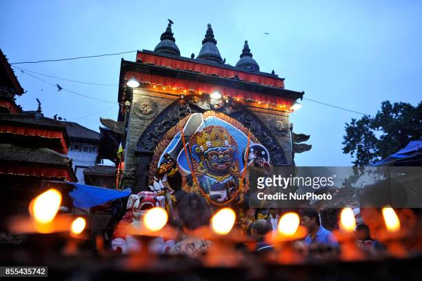 Devotees offered butter lamps infornt of Kaal Bhairab on the occasion of Navami, ninth day of Dashain Festival at Basantapur Durbar Square,...