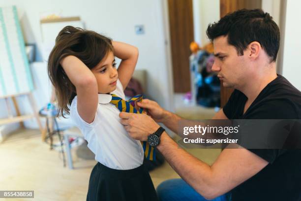 father is preparing girl for school - getting ready stock pictures, royalty-free photos & images