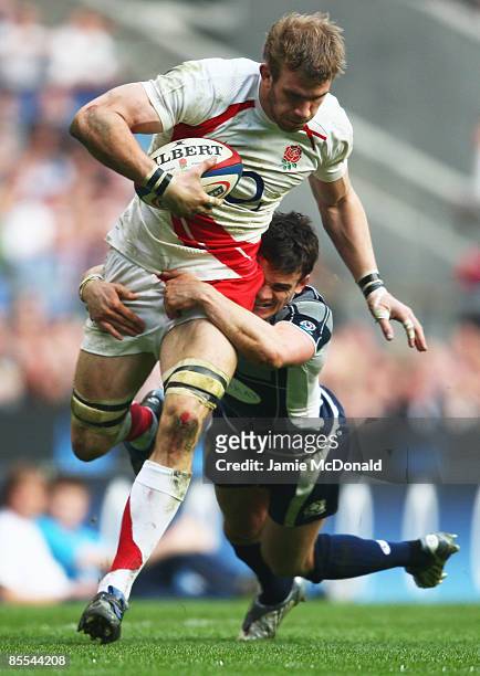 Thom Evans of Scotland tackles Tom Croft of England during the RBS 6 Nations Championship match between England and Scotland at Twickenham on March...