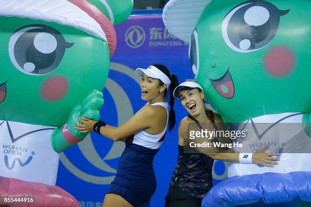 Yung jan Chan of Chinese Taipei and Martina Hingis of Switzerland celebrate following their victory during the Ladies Doubles semi final against...