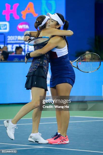 Yung jan Chan of Chinese Taipei and Martina Hingis of Switzerland celebrate following their victory during the Ladies Doubles semi final against...