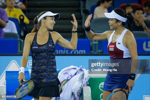 Yung jan Chan of Chinese Taipei and Martina Hingis of Switzerland celebrate following their victory during the Ladies Doubles semi final against...