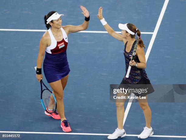 Yung-Jan Chan of Chinese Taipei and Martina Hingis of Switzerland celebrate following their victory during the Ladies Doubles semi final against...