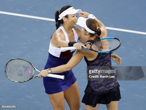 Yung-Jan Chan of Chinese Taipei and Martina Hingis of Switzerland celebrate following their victory during the Ladies Doubles semi final against...