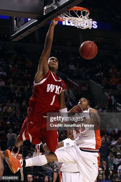 Sergio Kerusch of the Western Kentucky Hilltoppers dunks the ball over Dominique Keller of the Illinois Fighting Illini in the second half during the...