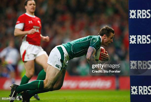 Tommy Bowe of Ireland goes over to score a try during the RBS 6 Nations Championship match between Wales and Ireland at the Millennium Stadium on...