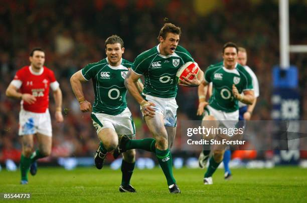 Tommy Bowe of Ireland breaks clear on his way to scoring a try during the RBS 6 Nations Championship match between Wales and Ireland at the...