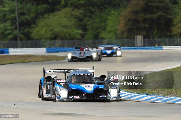 Team Peugeot 908 of Nicolas Minassian, Pedro Lamy, and Christian Klien leads an Audi R15 during the 57th Annual Mobil1 12 Hours of Sebring at Sebring...