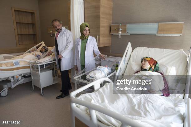 Turkmen mother Fatma Birinci and her daughter Gade Birinci pregnant at the same time, lay hospital beds with the babies named Recep and Tayyip after...