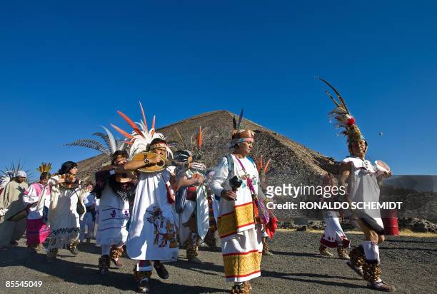 Mexican dancers in Aztec costumes perform in front of the Pyramid of the Sun in Teotihuacan, Mexico, during the celebrations for the Spring Equinox...