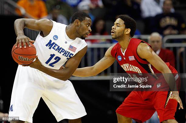 Tyreke Evans of the Memphis Tigers looks to make a move against Sean Mosley of the Maryland Terrapins in the first half during the second round of...