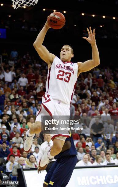 Blake Griffin of the Oklahoma Sooners jumps to the net for a layup against the Michigan Wolverines during the second round of the NCAA Division I...