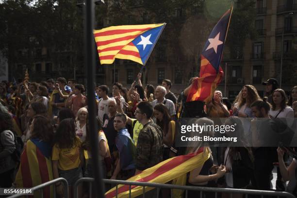 Supporters of Catalan independence wave separatist flags during a demonstration organised by the University of Barcelona in Barcelona, Spain, on...